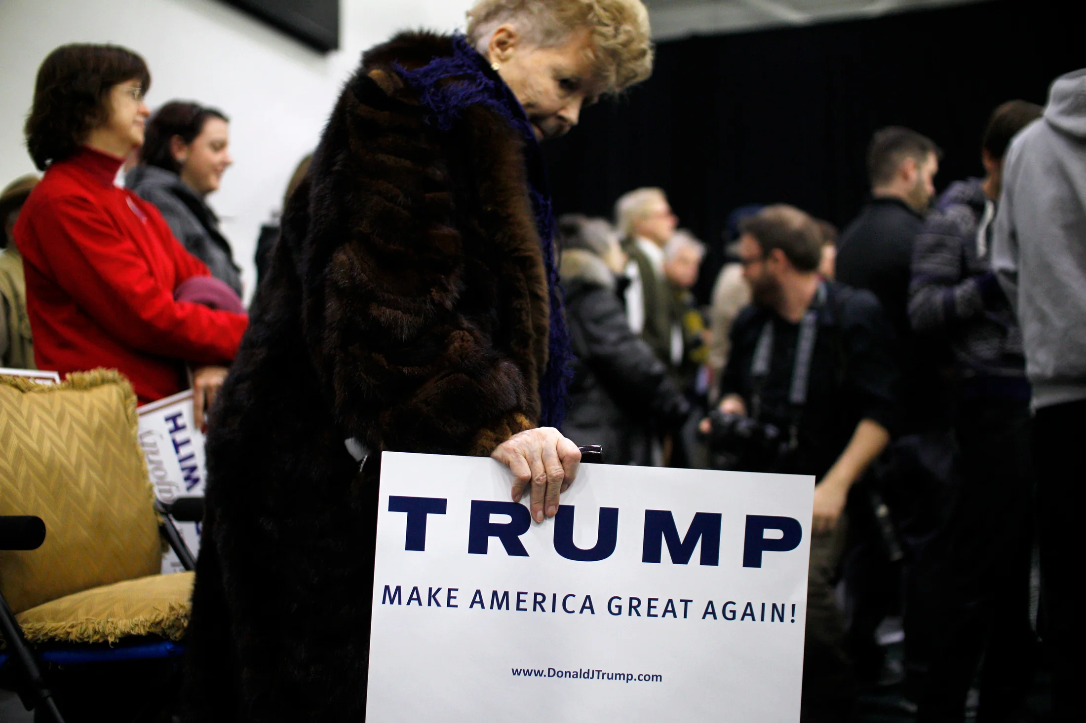A supporter of Republican candidate for President Donald Trump awaits the candidate arrival at a rally at Plymouth State University in Holderness, New Hampshire on February 7, 2016. New Hampshire will hold the first primary in the nation on February 9th.