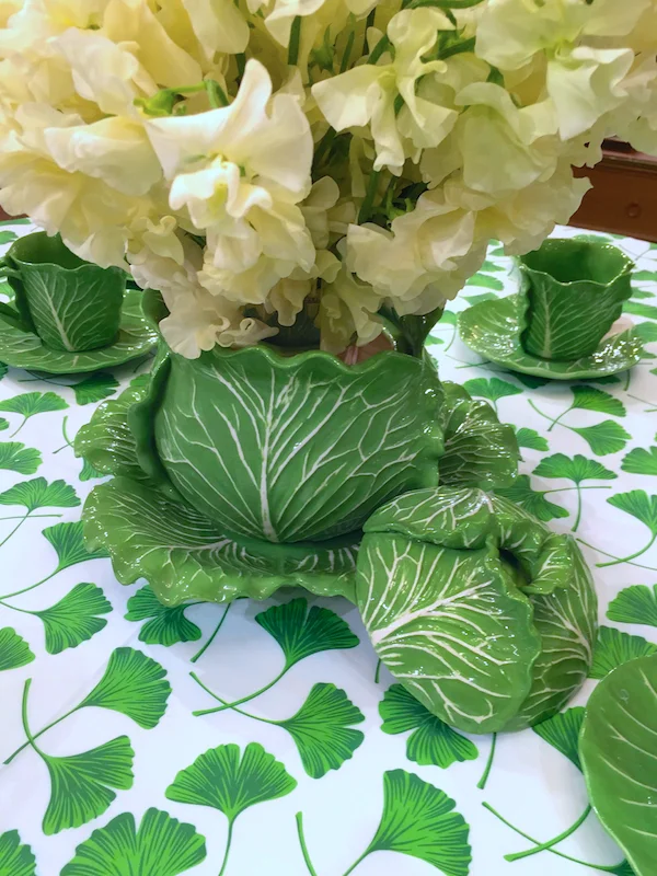 Rather than an entire table setting, I'd be inclined to go with one standout piece, like this tureen which Ms Thayer says was one of her favorite pieces to make. Here it sits atop a Tory Burch Ginkgo print tablecloth