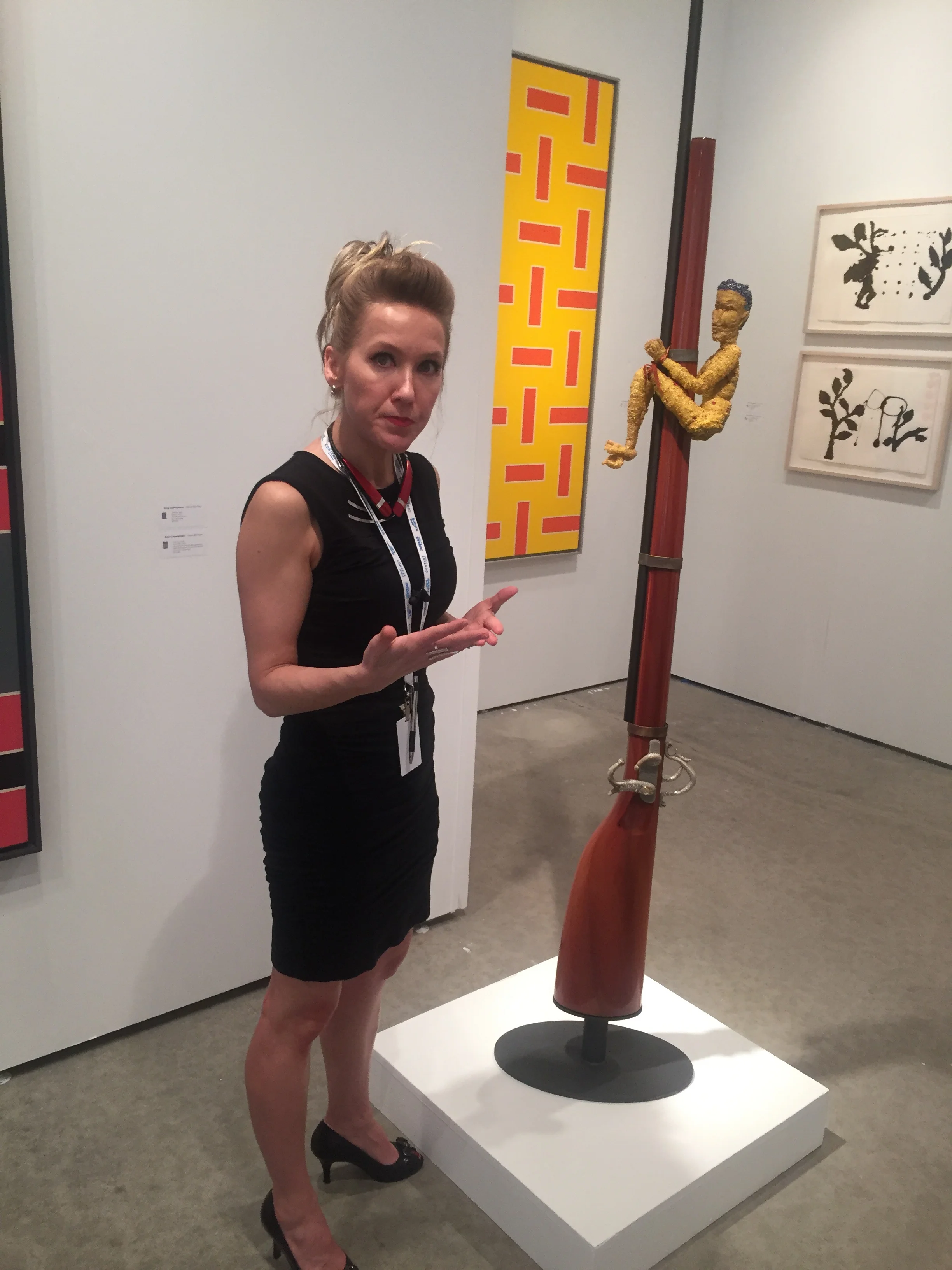 Amy Raehse, Executive Director & Curator, Goya Gallery alongside a compelling sculpture by Joyce Scott