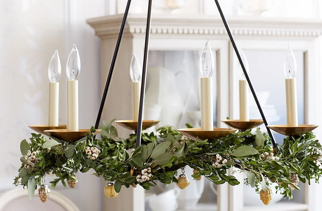 The chandelier gets decorated too...simplicity is key here with ivy and golden acorns sparingly woven throughout