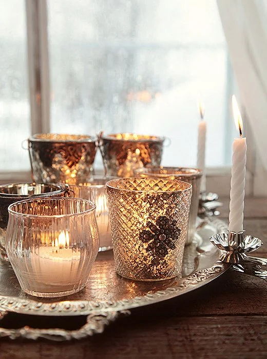 Glamour and sparkle with an eclectic mix of crystal and silver votives for a traditional vibe