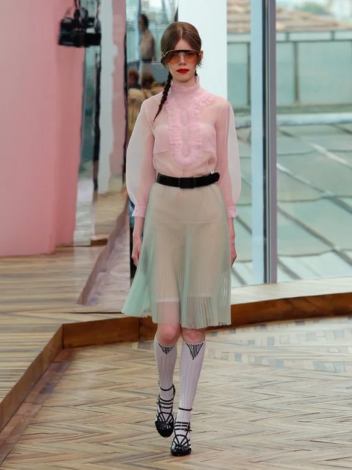 Pretty pastels with delicate ruffle pleated details of Prada ruffle trimmed organza top and high-rise pleated skirt