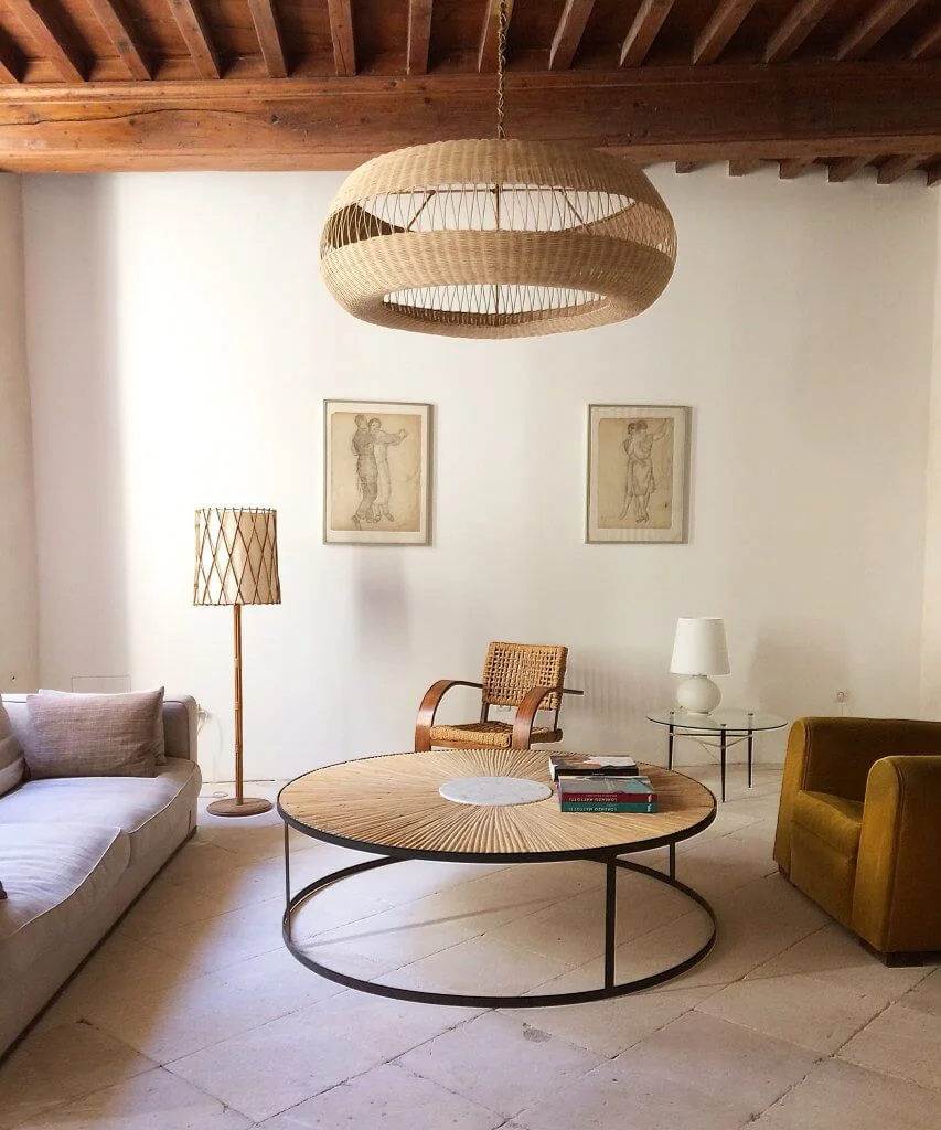 XXL rattan marquetry table fits seamlessly with the Adrien Audoux & Frida Minet 1940s armchair and leather club chair