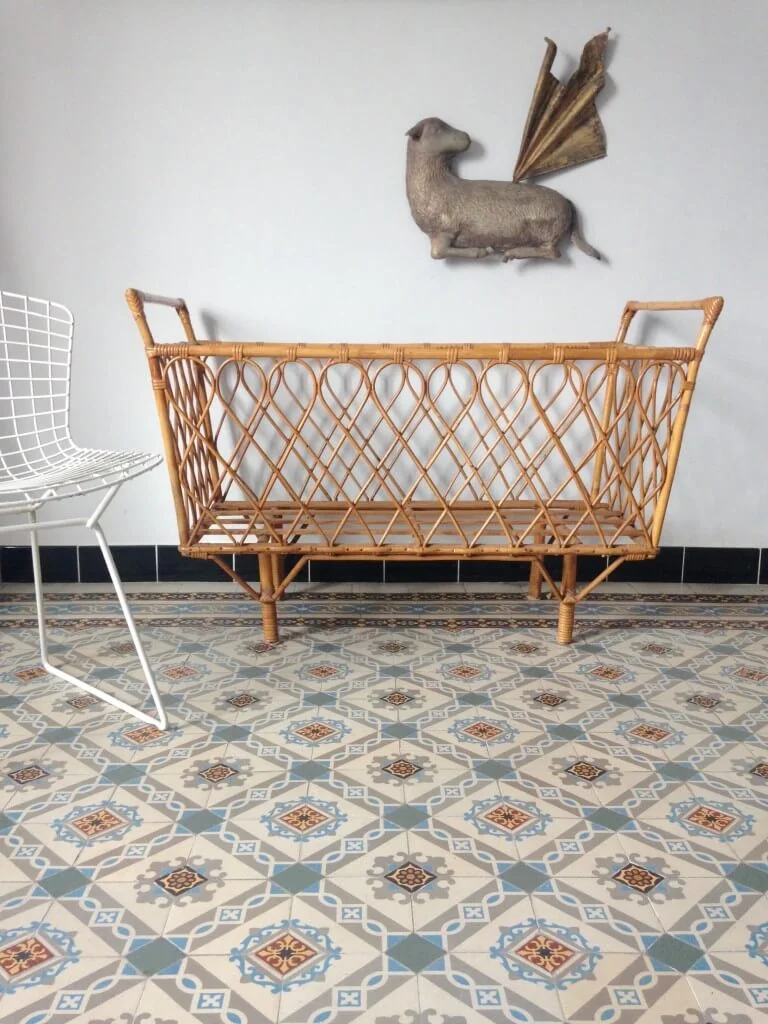 It's as much about the beautifully tiled floor as it is about the custom crib that looks like an art installation in this setting