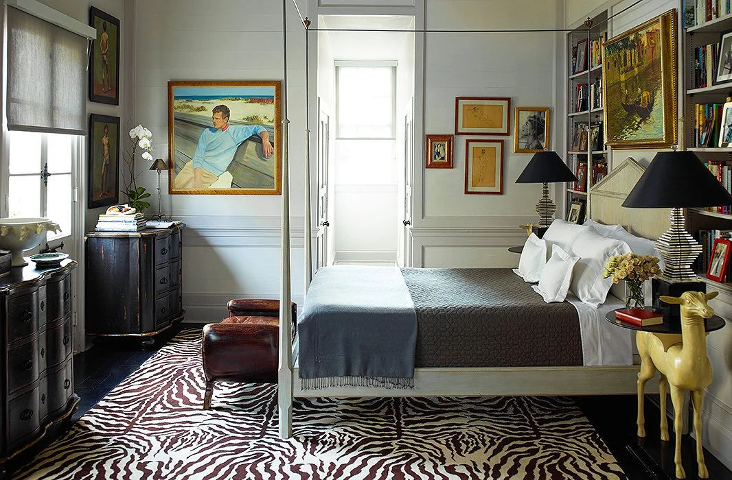 A more dramatic zebra print livens up this bedroom and note the large area the rug covers - when you get out of bed the first thing you feet touch is the warmth and luxury of a floor covering - designer Peter Rogers, photography Eric Piasecki