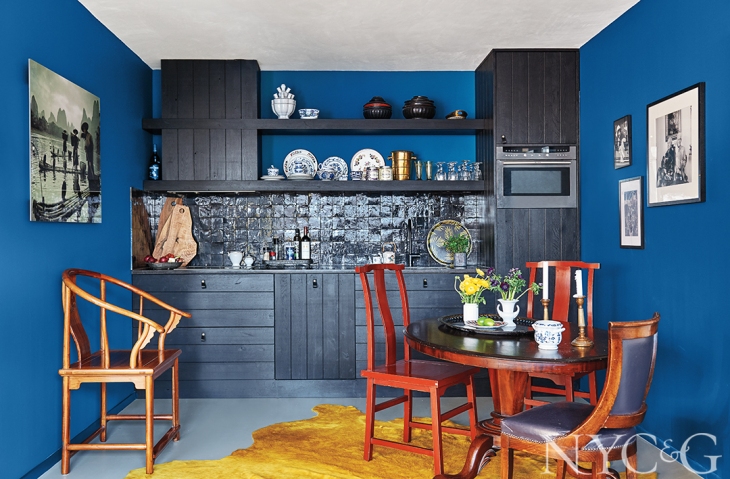 Hague Blue by Farrow & Ball covers the walls making a vivid backdrop for this compact 860 sq ft 2-bedroom apartment