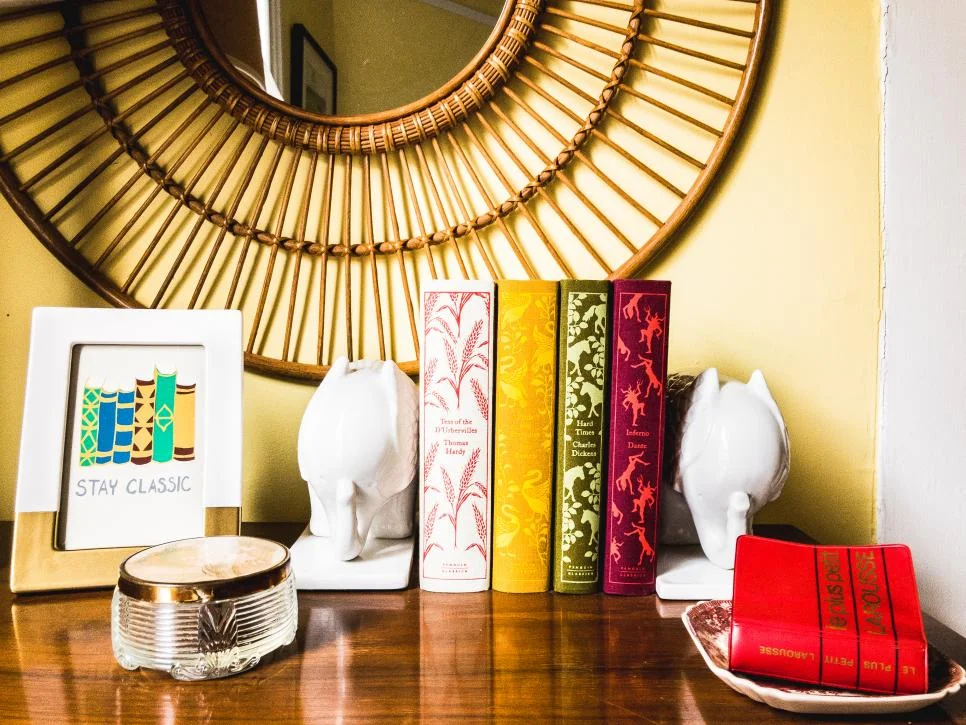 An avid collector of “unnecessary objects” Susan’s tiny French dictionary and Coralie Bickford Smith Penguin editions make a decorative vignette atop her guest bedroom dresser