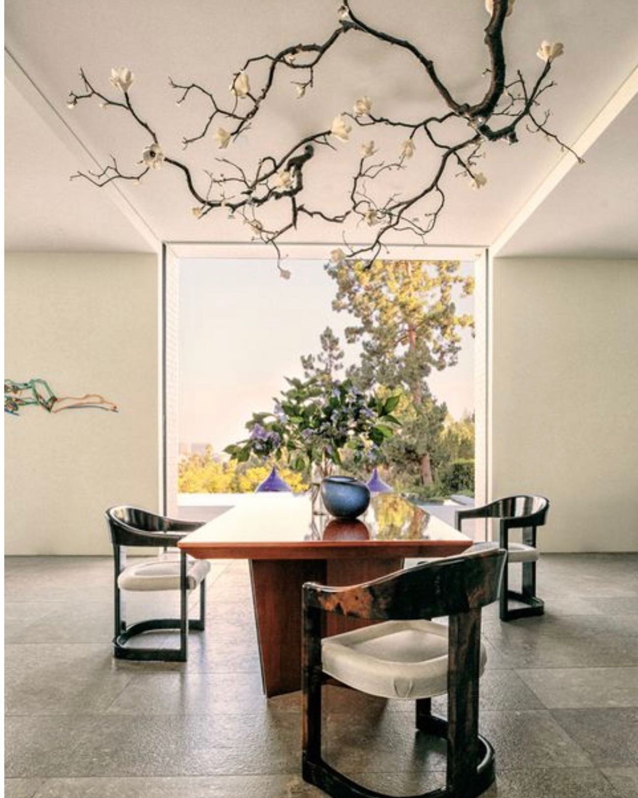 The organic contours of this statement bronze and ceramic light fixture by David Wiseman above the Vladimir Kagan dining table and Karl Springer dining chairs perfectly complements the Tom Wesselman artwork...classic elements of mid-century splendor 