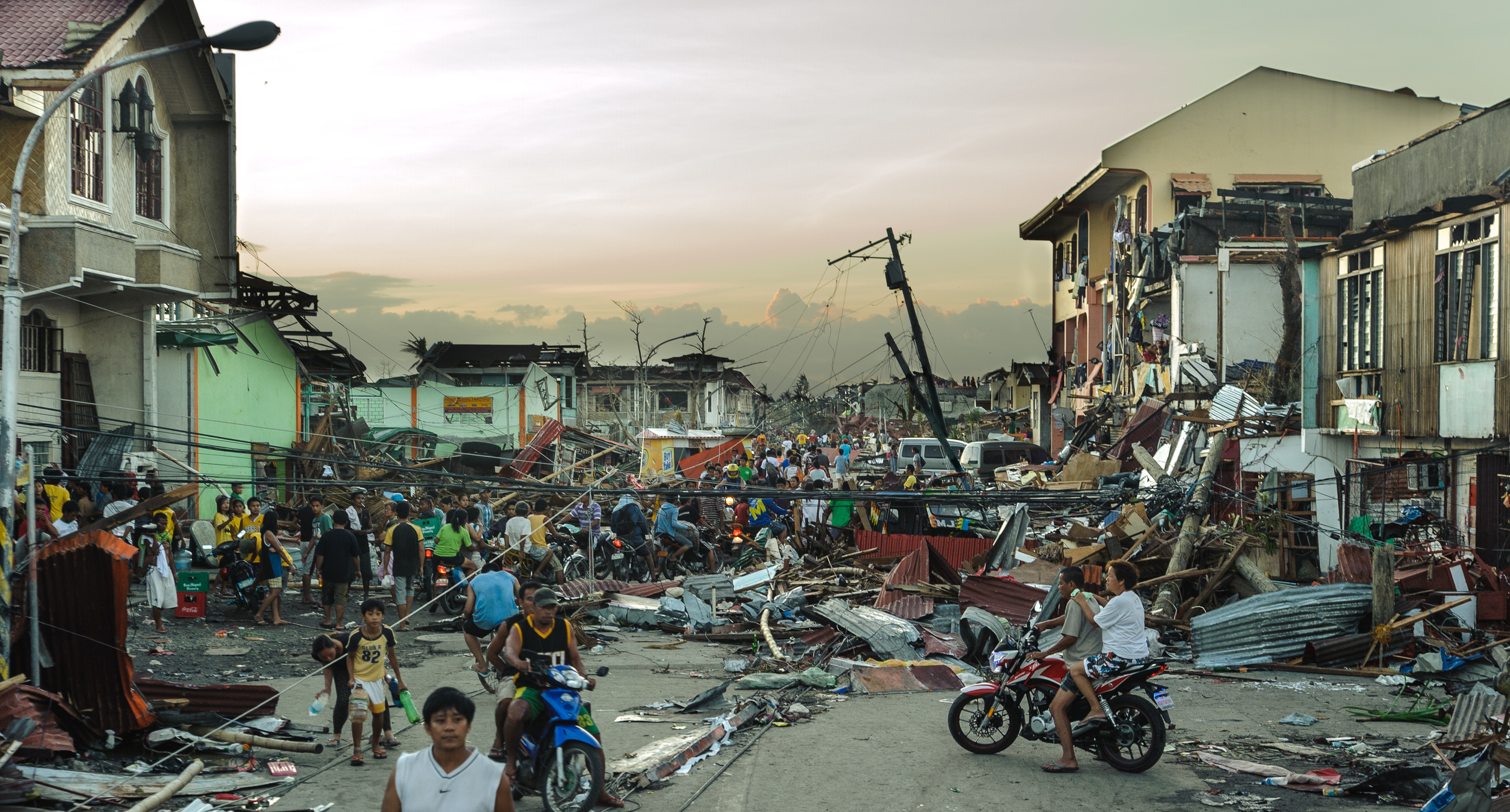 Dusk along the main road into Tanauan, 48 hours following the landfall of Typhoon Haiayan.
