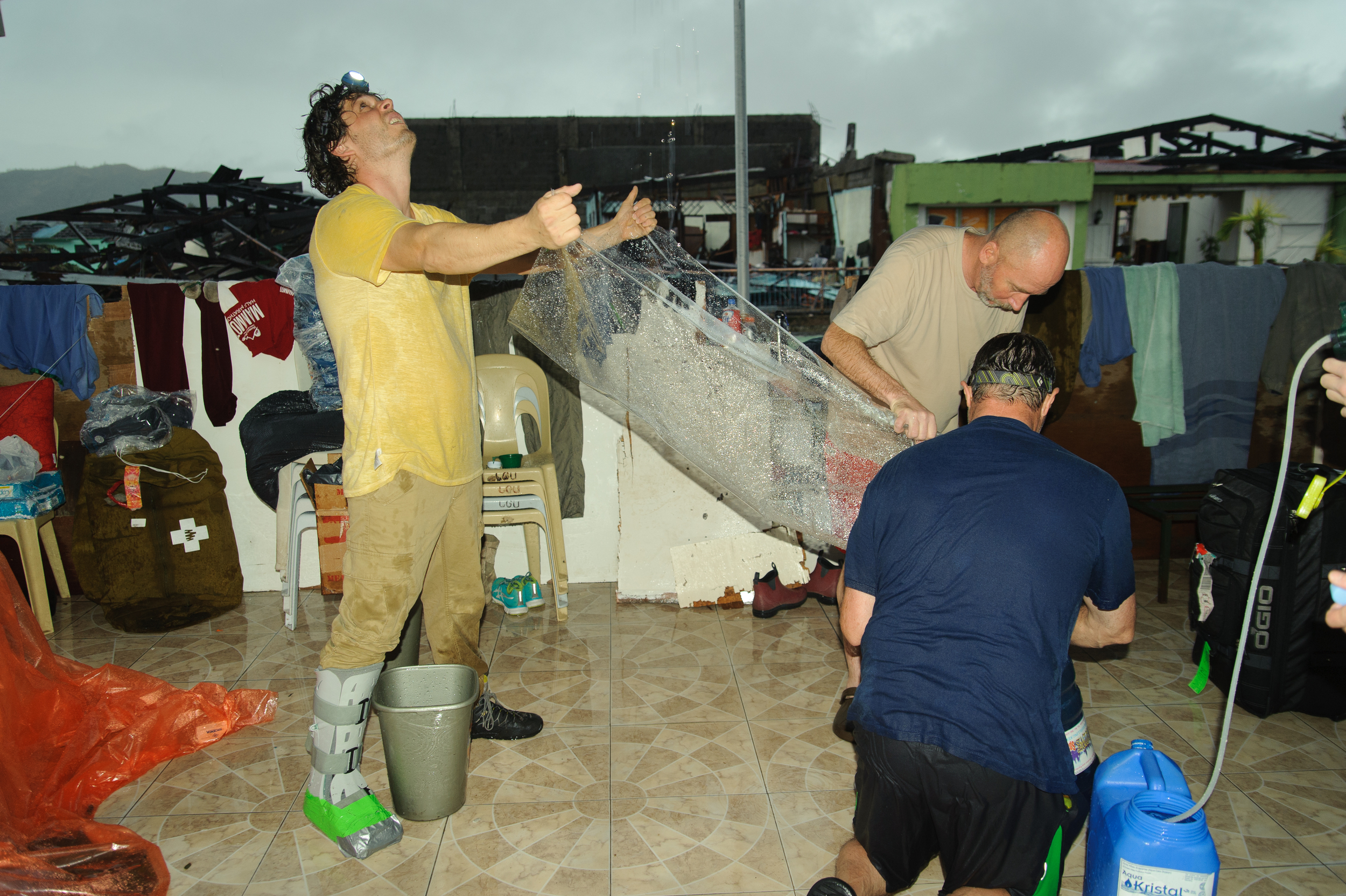 Team members collect rainwater which, after being filtered and treated with iodine, they then utilize for both patient care and as their primary source of drinking water.