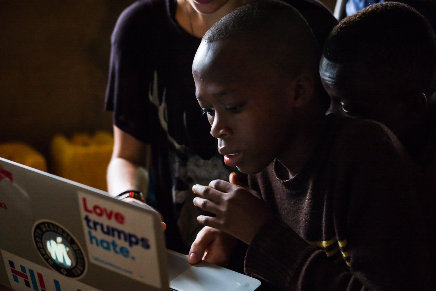 April 2017. 634 photographs later, Francis dives into his first-ever photo-editing session. Here, volunteer Emma Dugdale with the We Yone Child Foundation has come to Francis' home and walks him through the art of "less is more."