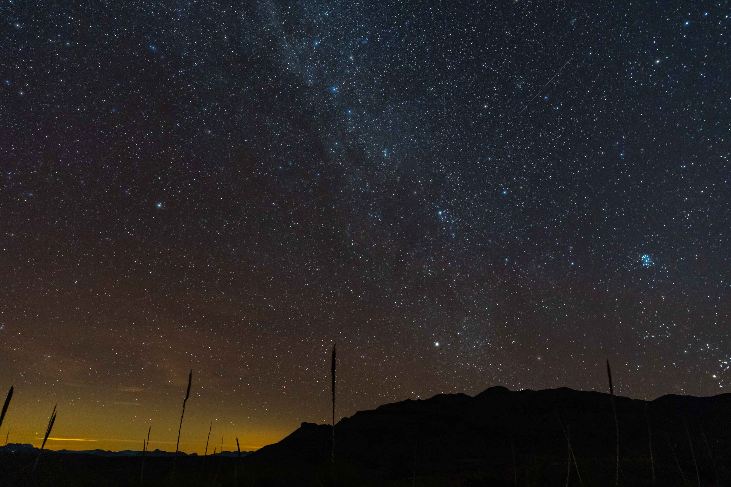  November: the Pleiades Cluster (right) and a billion other stars, appear above Big Bend National Park. 