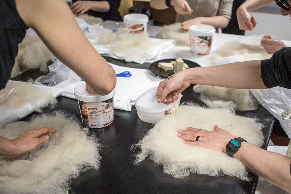 Felt Material + water + soap + dabbing forces the felt material to bind together and make sheets.