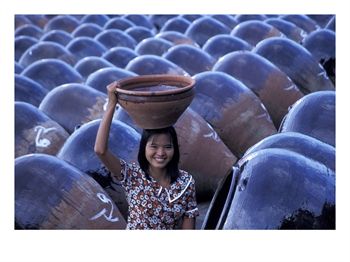 AS06_KSU0025_M~Girl-with-Pottery-Jars-Myanmar-Posters[1].jpg