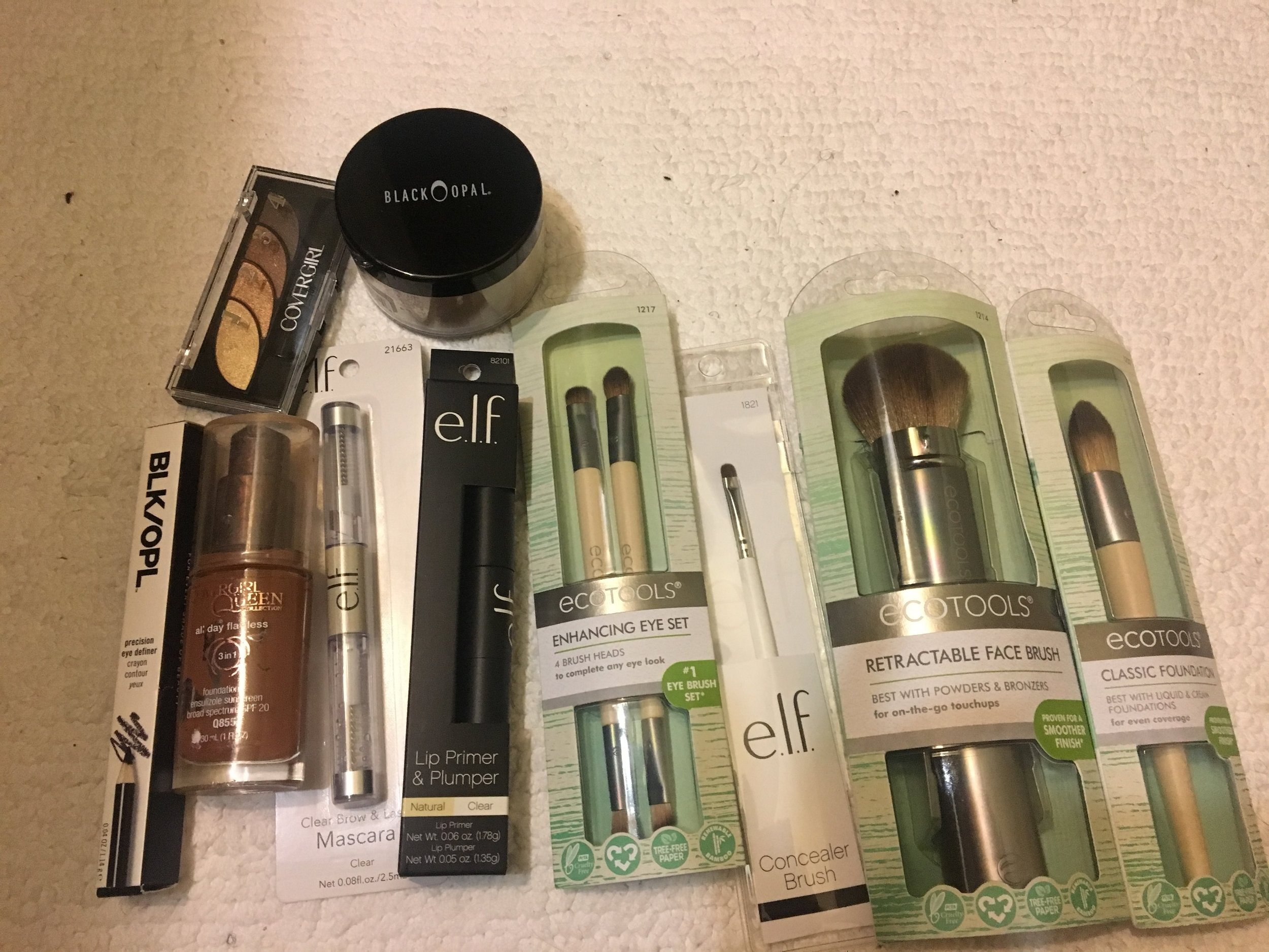 Black Opal Dark Brown Eyeliner, Cover Girl Spicy Brown (found under the sink, Elf Clear Mascara, Elf Plumper/Primer, Eco Tools Enhancing Eye Set, Retractable Face Brush, Classic Foundation Brush, Cover Girl 705 Eyeshadow, Black Opal Dark Loose Powder.