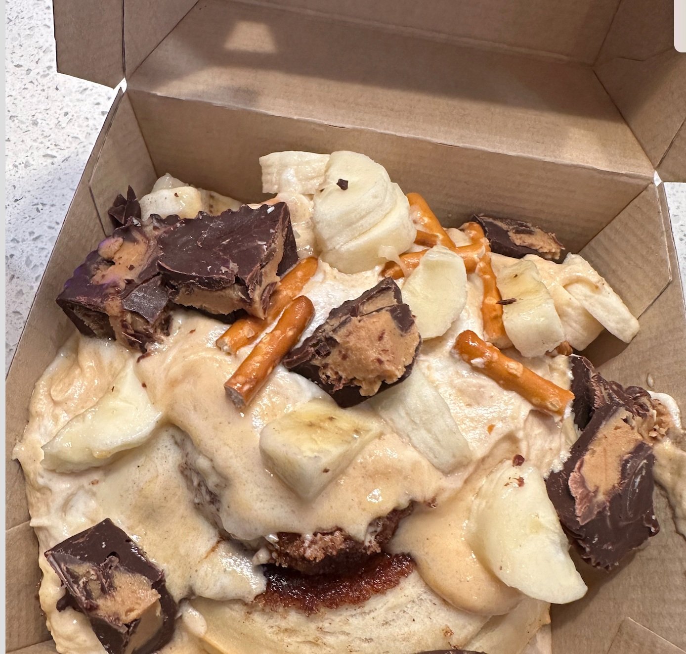  Shake Rattle and Roll -    Peanut butter frosting topped with homemade peanut butter cups, fresh bananas and pretzels.   Gifted to a friend.  