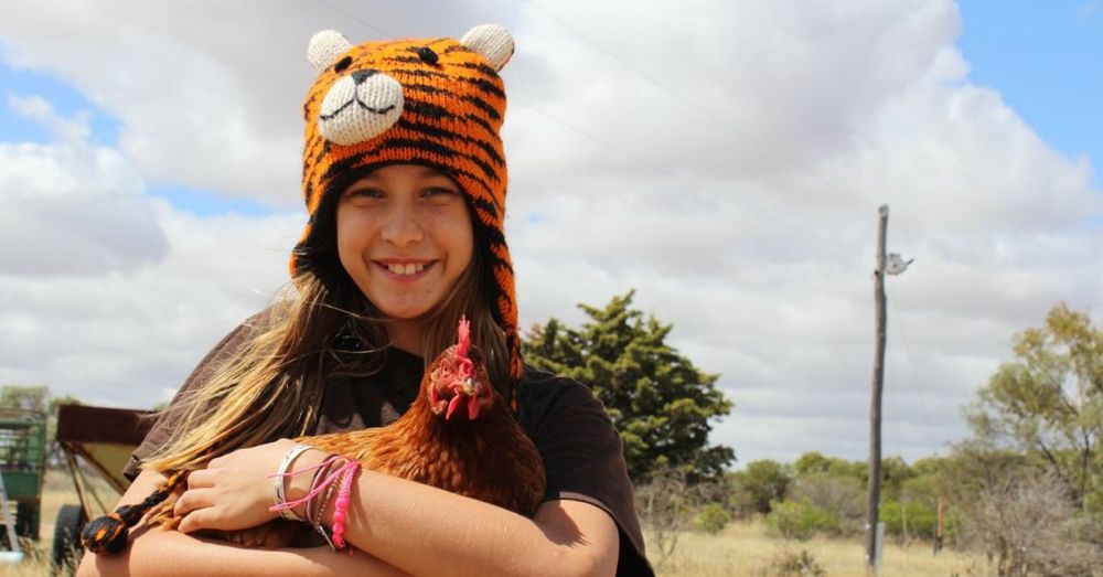 A girl and her chicken.