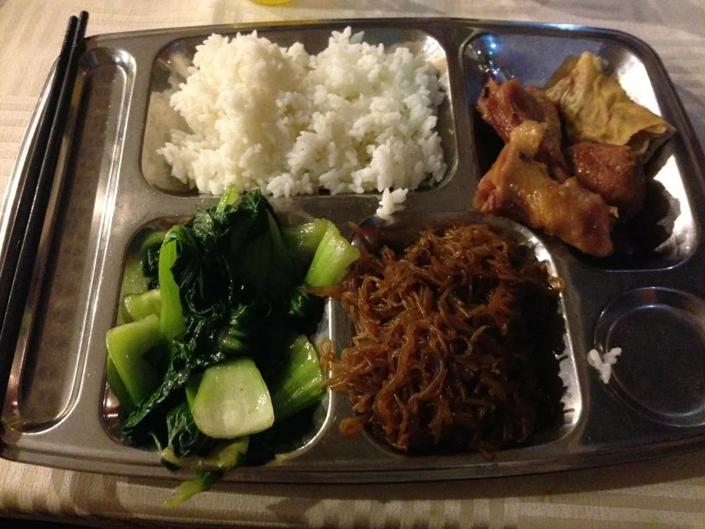 It looks like rice, chicken, vegetables and noodles, but not sure what this really was