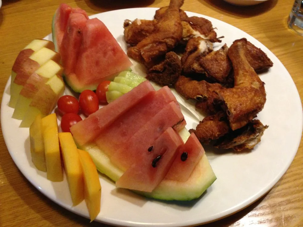 Fried chicken and fruit plate