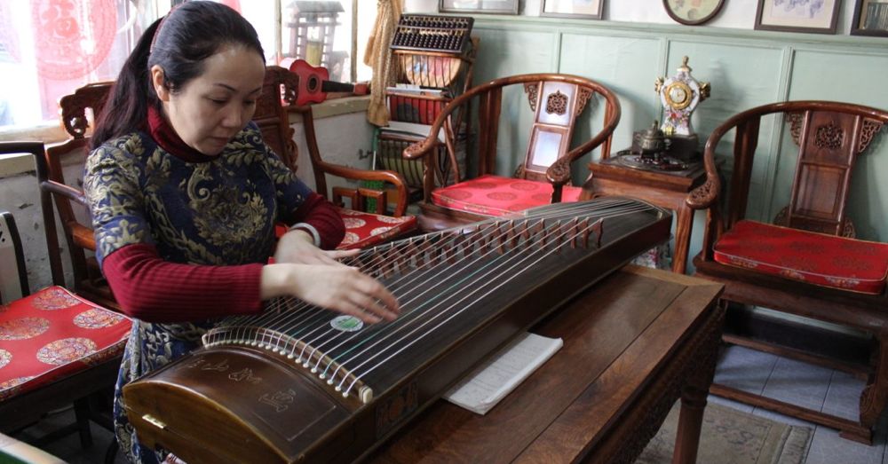 Woman playing a Guzheng