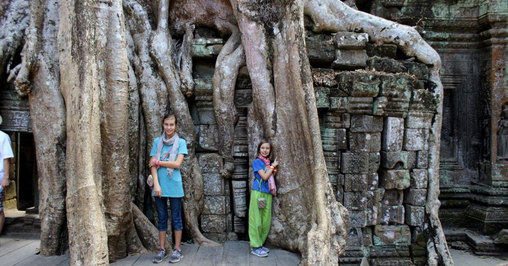 Girls among the roots in Ta Prohm
