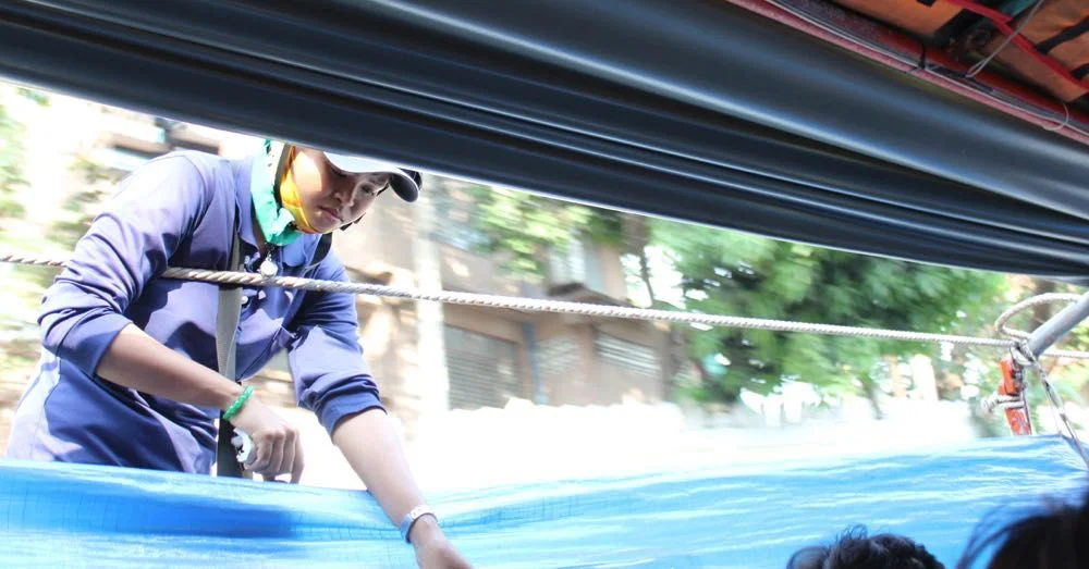 Taking tickets on the Khlong Saen Saep Express