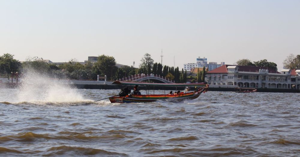 Long-tail boat on the move.