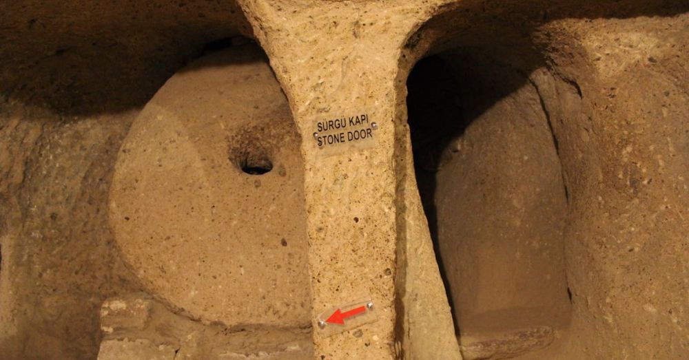 Disc-shaped stone door with a peephole