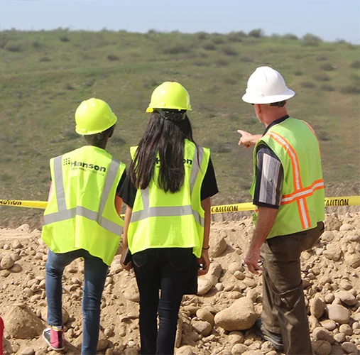 A few students asking Eddie Chapman questions about the hillside.