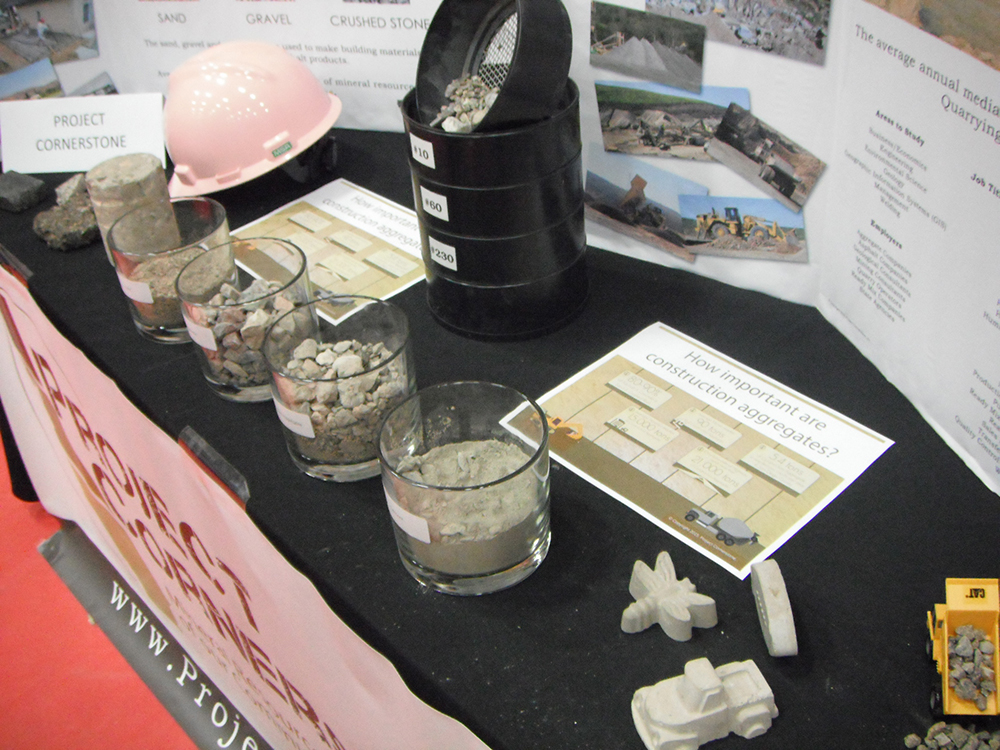 Construction aggregate samples and industry facts displayed in the Project Cornerstone Career Day booth.