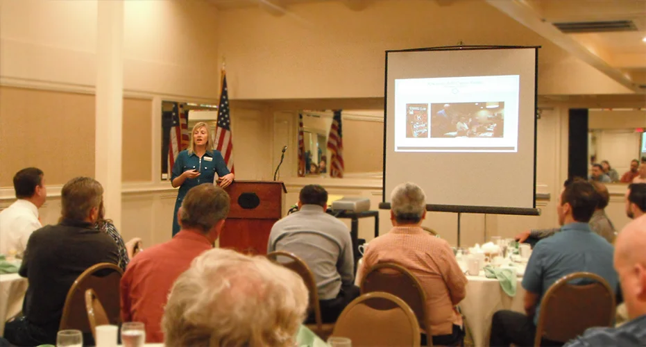 Crystal Howard discussing Project Cornerstone's activities for the previous quarter.