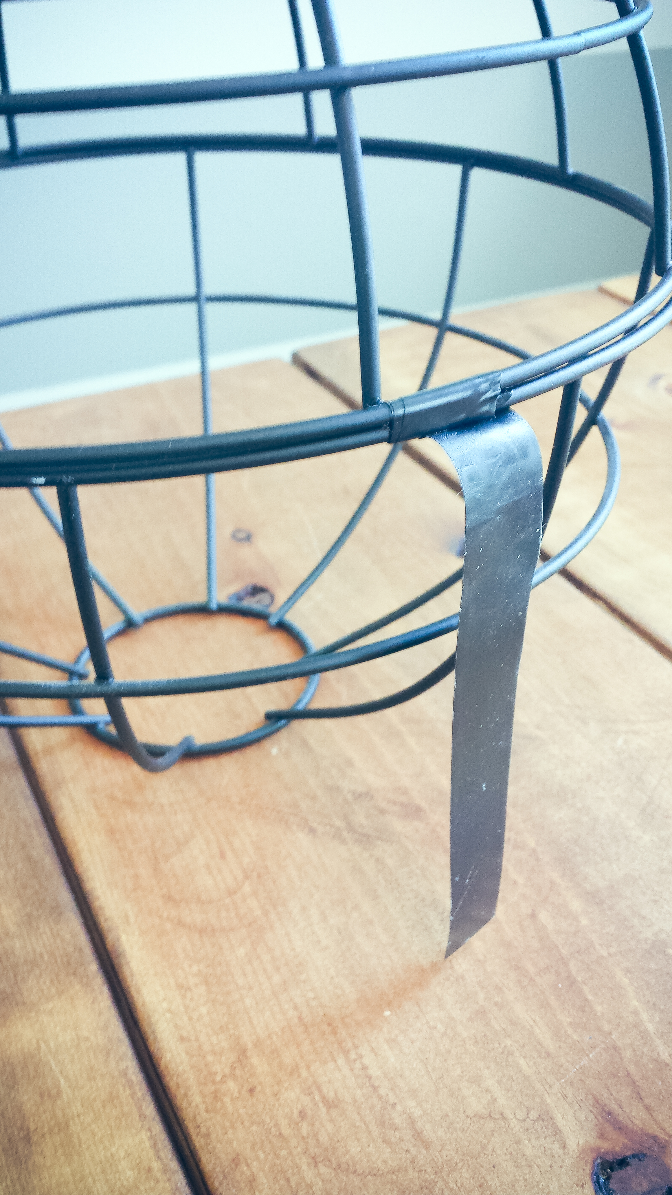 Cut a strip of electrical tape (about 3in long) and begin to wrap it around.