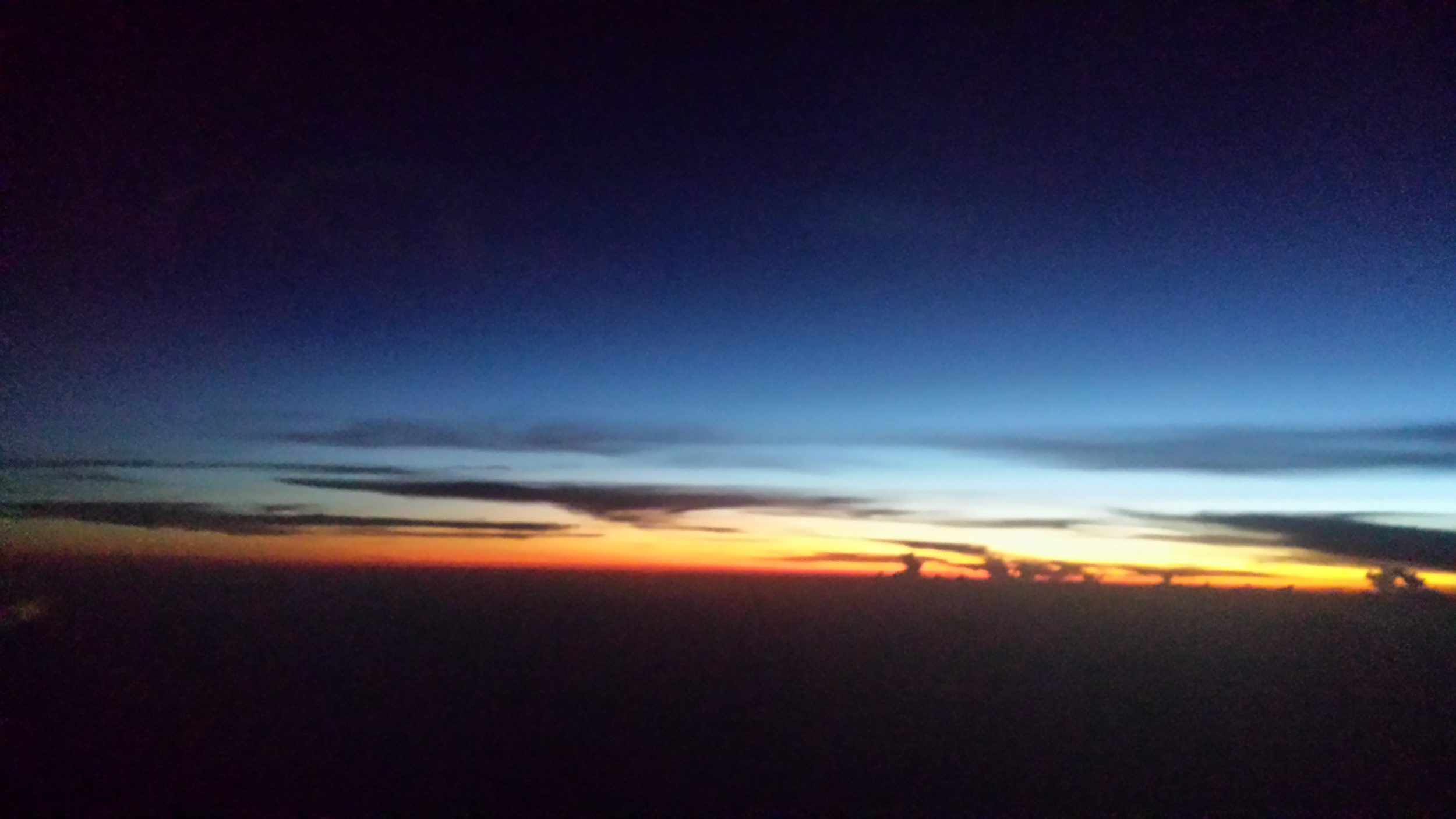 Sunset viewing through an airplane window...en route to Nicaragua.