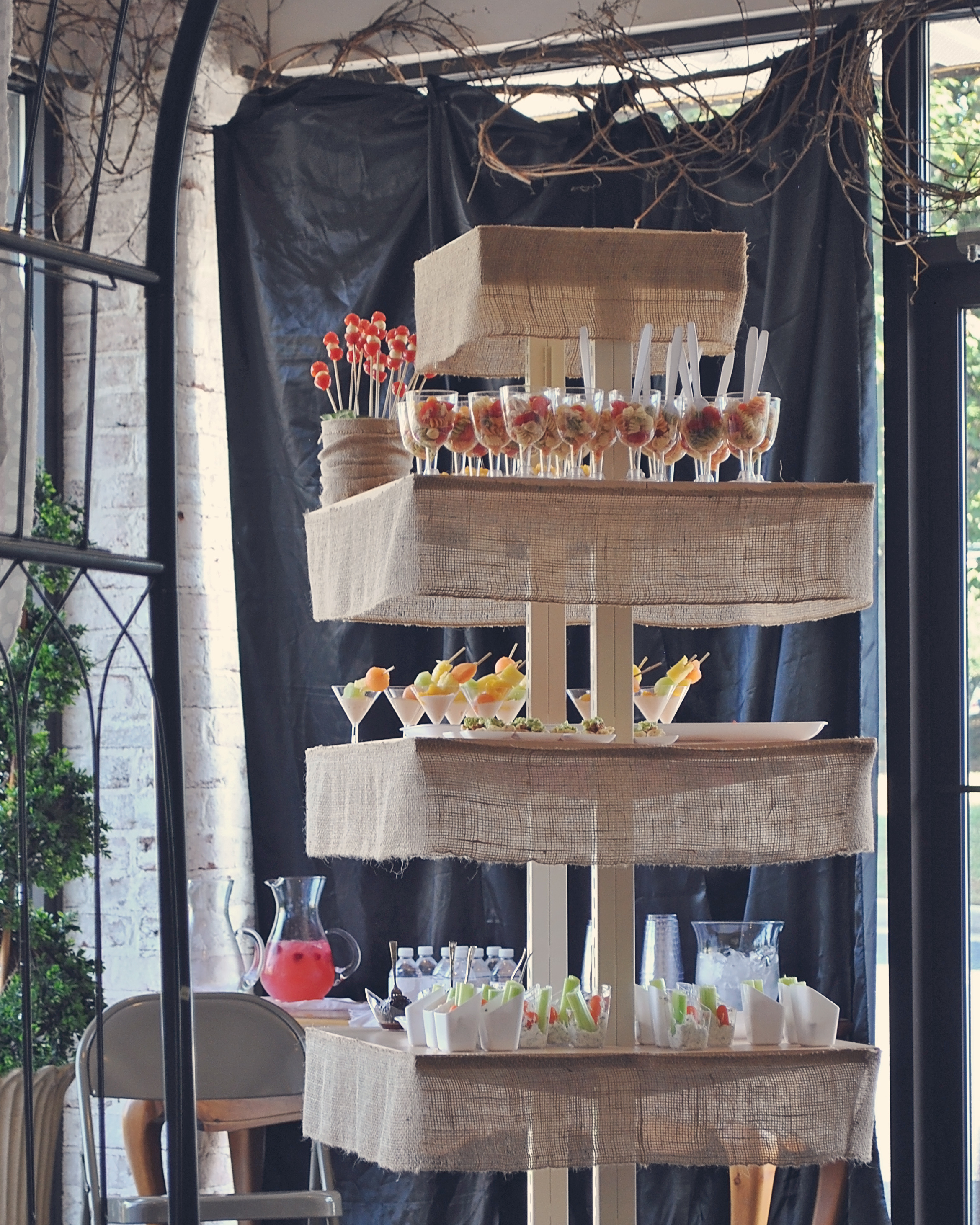 The place where we held the shower had this stand and we decided to put all the food there. All we did to it to bring it up a notch was to add burlap ribbon around the edges. I loved how it looked. 
