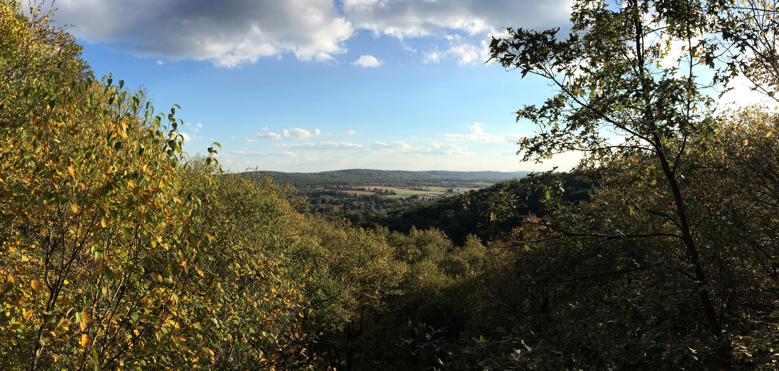A panoramic shot I took on 10/8 from the top of the mountain, overlooking miles of farmland and trees.