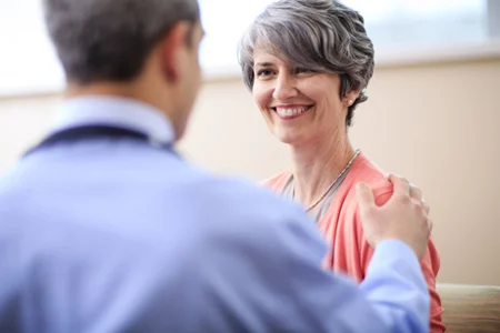 cdh-proton-center-doctor-patient-smiling.jpg