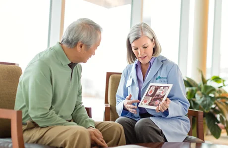 Getting-treated-doctor-with-patient-man.jpg