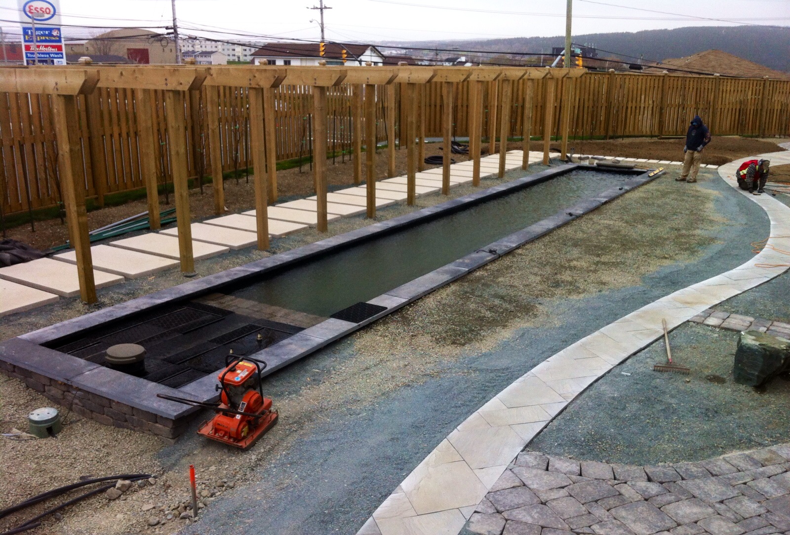 Getting ready to lay black sandstone.jpg