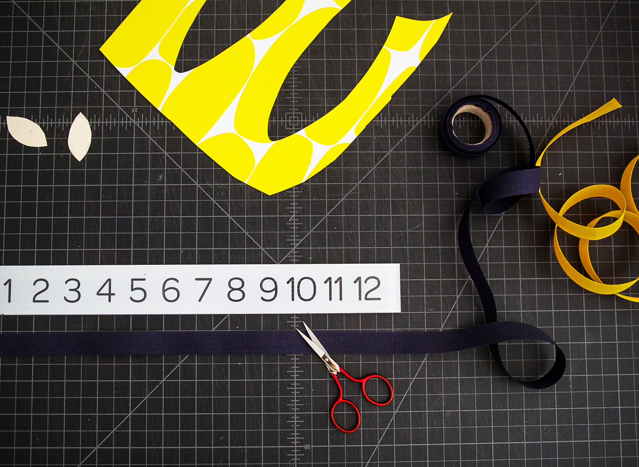 Step 7: Measure two lengths of ribbon long enough to tie around you head. (We used Tight Weave Cotton Ribbon in dark indigo .) Give yourself a little extra. You can always trim.