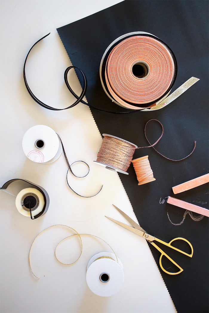 Supplies: for this project we used black craft paper and a assortment of Studio Carta ribbon, including: metallic loose weave ribbon in gold, peach and copper; wide metallic tight weave in black with gold and copper, as well as peach and gold; thin metallic tight weave in peach and gold; as well as thin metallic braided ribbon in gold, rose gold and graphite.
