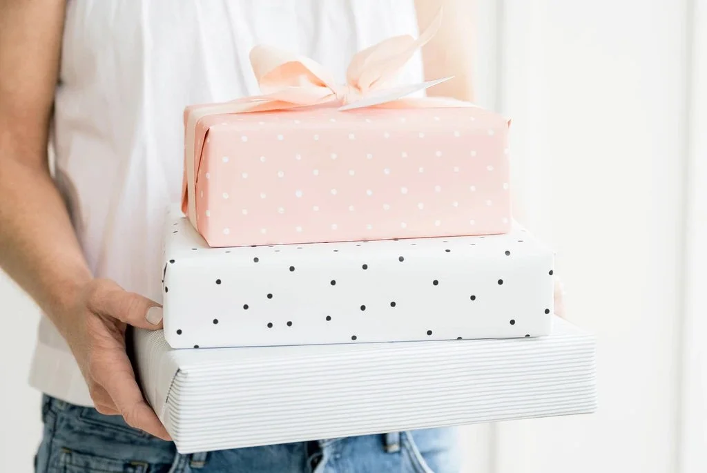 SP_Gift_wrap_Jamie_holding_a_stack-web_1024x1024.jpg