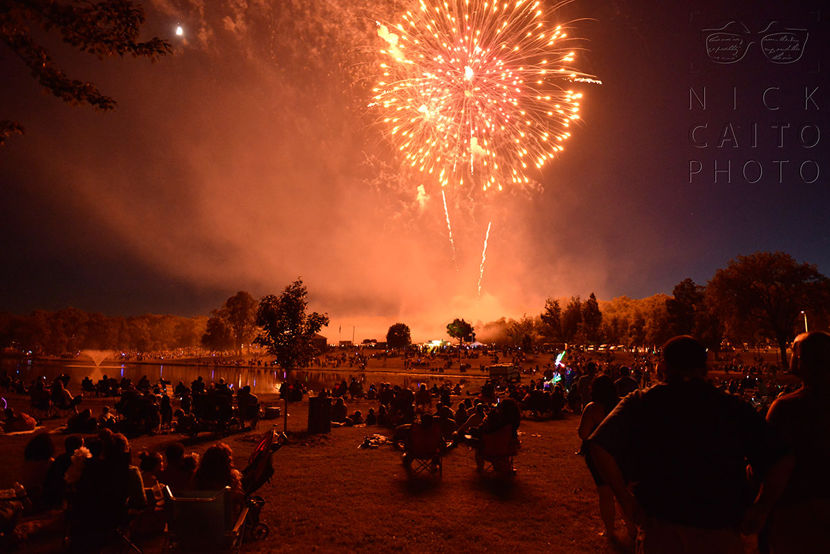 "Great American Boom" at Stanley Quarter Park in New Britain. I wanted to capture the park filled with thousands of spectators. I was leaving early to file photos on deadline, and stopped to capture this near the park entrance. July 5 2014. f/2.8, ISO 3200, 1/15s