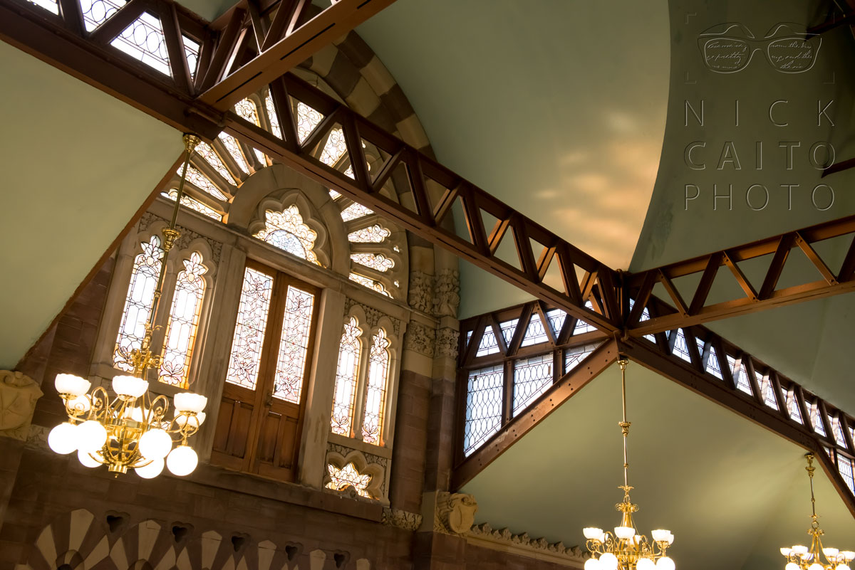 Gorgeous stained glass around what appears to have once been a balcony.