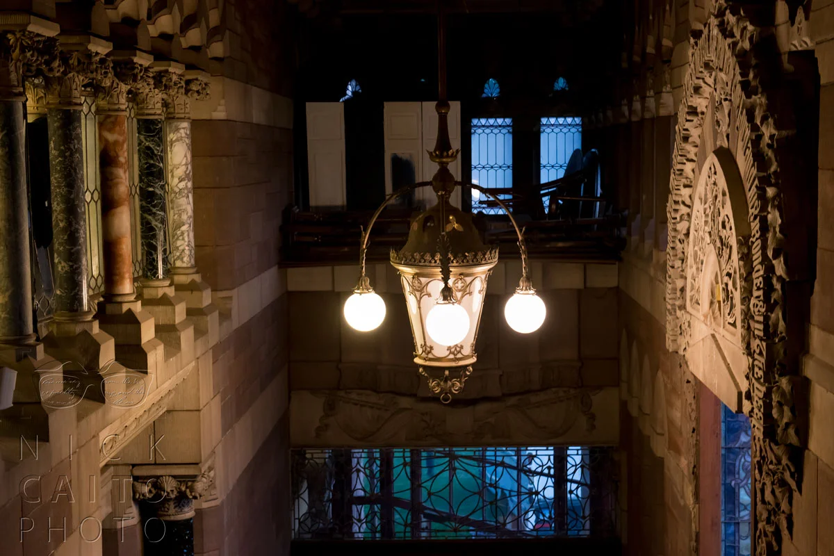 Beautiful light fixtures, marble pillars.