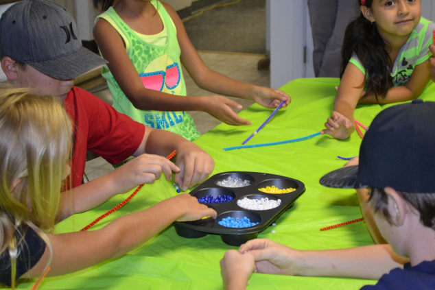 Making water cycle bracelets.