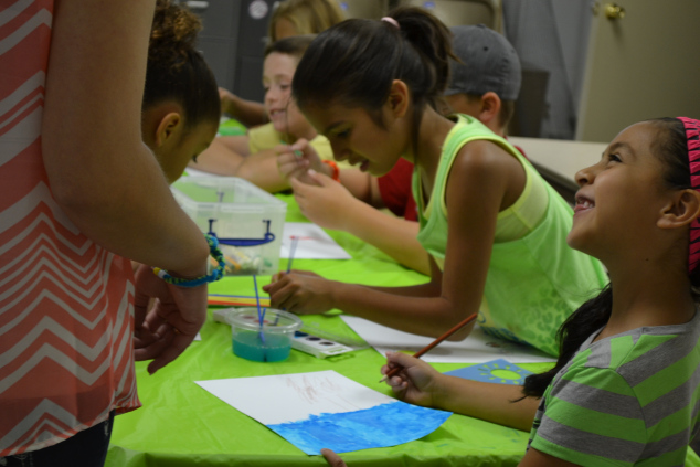 Painting water conservation posters.