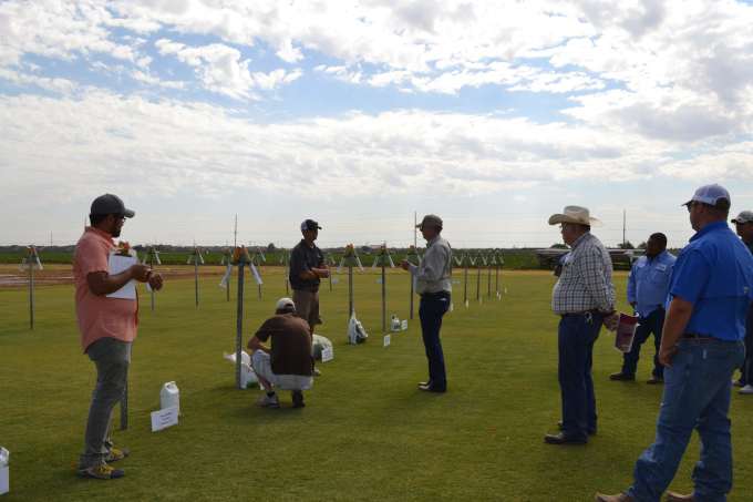 Left to right: Vikrim Baliga and Joey Young talking to the homeowners group about various residential wetting agents.