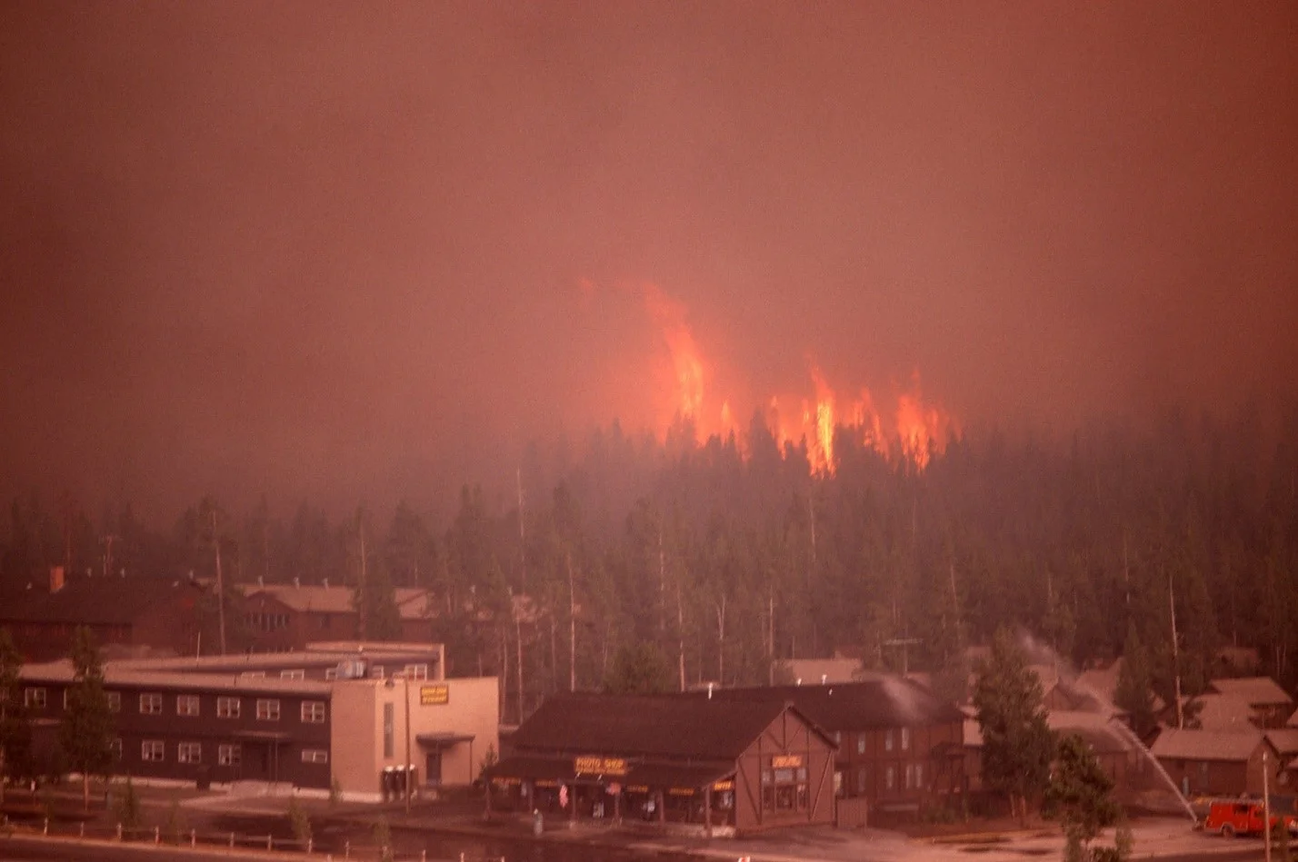 Crown fire approaching Old Faithful Lodge, Yellowstone National Park, Wyoming; Source: www.nps.gov