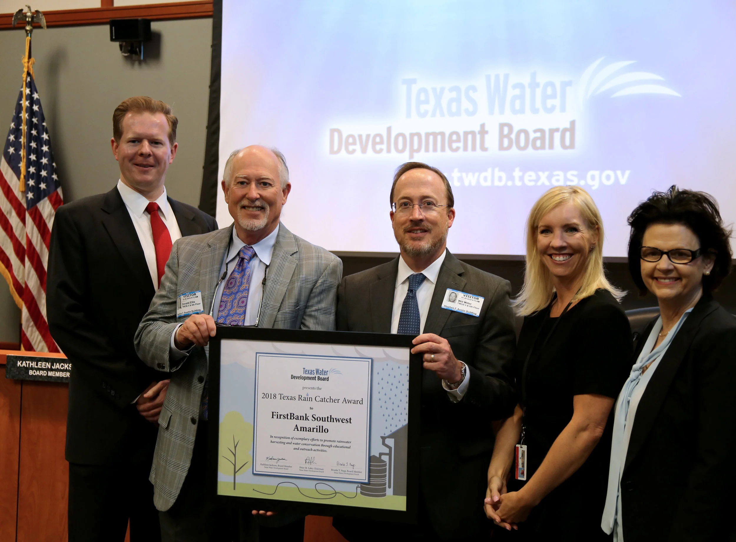 FirstBank Southwest Chairman of the Board Smith Ellis and Chief Lending Officer Will Miller accept the 2018 Texas Rain Catcher Award during the March 28 Texas Water Development Board (TWDB) meeting in Austin. Shown with them (L-R) are TWDB Chairman Peter Lake, Member Brooke Paup, and Member Kathleen Jackson.&nbsp; (Photo courtesy TWDB)