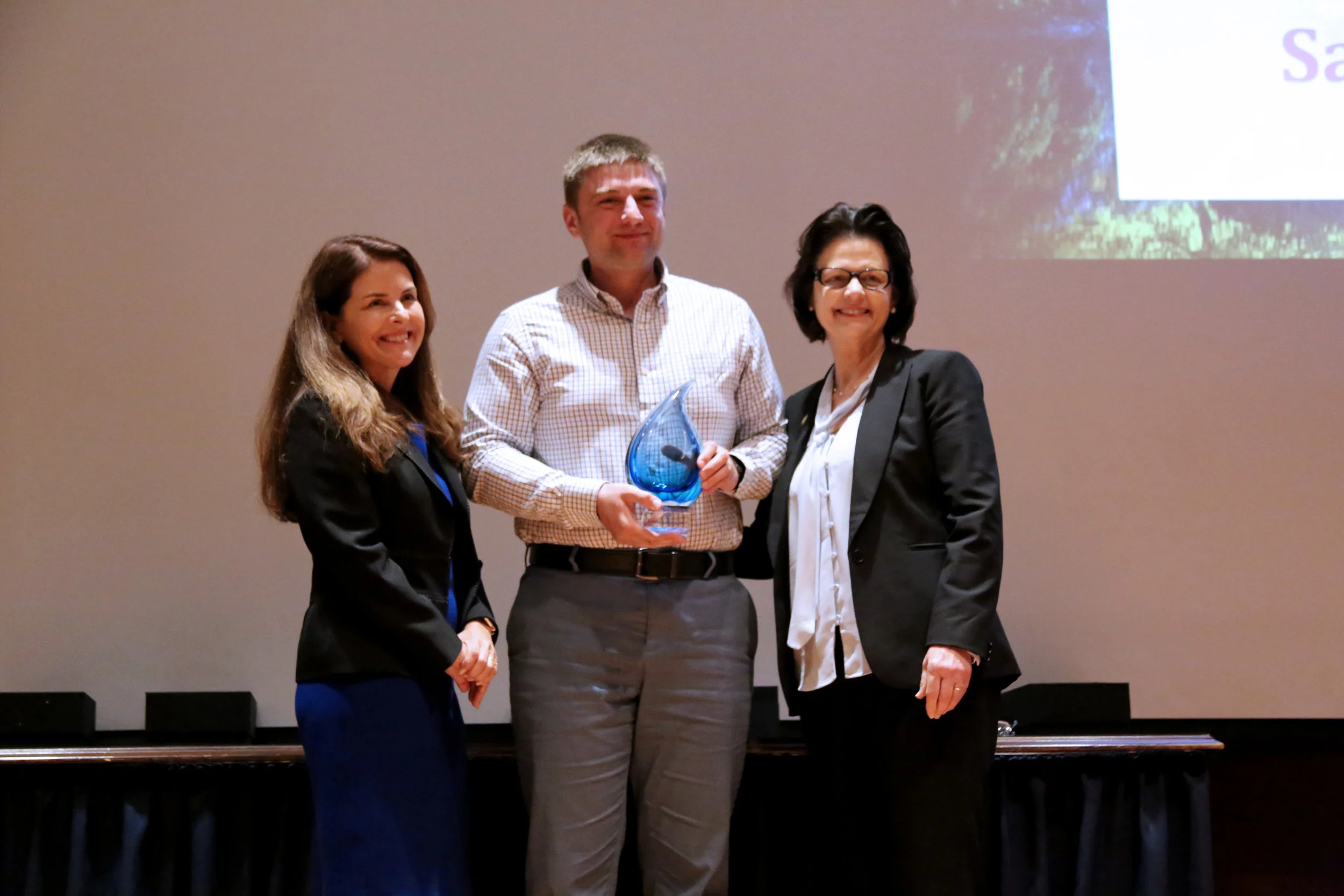 Dr. Bogdan Jackson-Duda with Samuel Jackson, Inc. accepts the Blue Legacy in Manufacturing Award from Water Conservation Advisory Council Chair Karen Guz (L) and Texas Water Development Board Member Kathleen Jackson (R).&nbsp;(Photo courtesy TWDB)